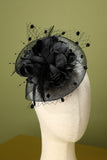 Bandeau perlé de plume noire des années 20