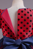 Robe de fille à pois rouges avec manches bouffantes
