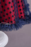 Robe de fille à pois rouges avec manches bouffantes