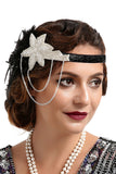 Bandeau perlé de plumes noires et dorées des années 20