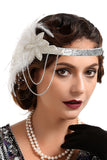 Bandeau perlé de plumes noires et dorées des années 20